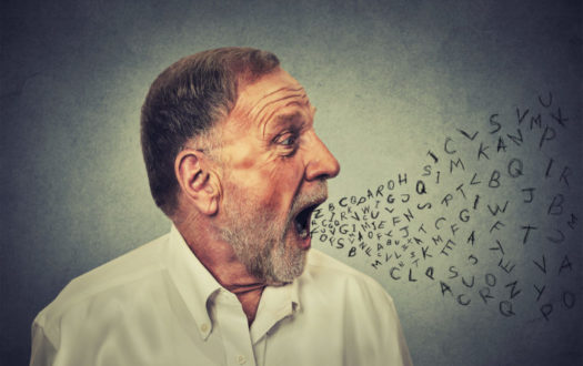 Man talking with alphabet letters coming out of mouth