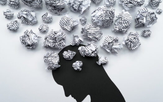 Waste paper and head silhouette.