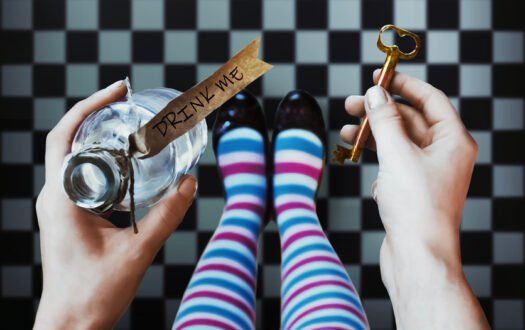 Alice in wonderland. Background. A key and a potion in hands against a  chess floor