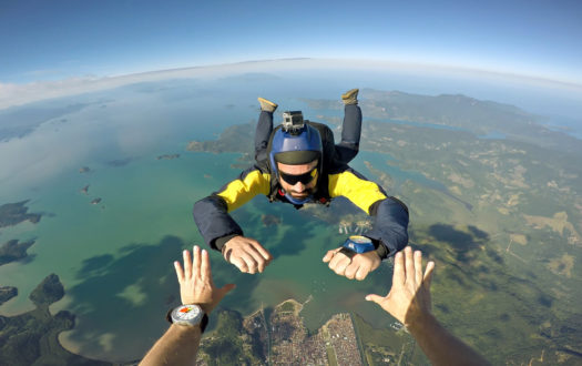 Skydiver point of view above the beach